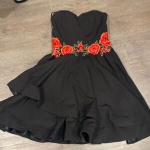 Strapless black flowy dress with roses across waist